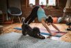 Woman Doing Yoga With Her Dog