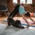 Woman Doing Yoga With Her Dog