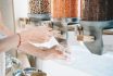 Woman Pours Red Lentils In Glass Jar From Dispensers In Zero Waste Shop.