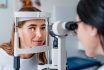 Eye Doctor With Female Patient During An Examination In Modern Clinic