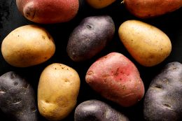 Potatoes, Different Types And Colors Of Potatoes On A Black Background.