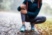 Unrecognizable Athlete Holding Her Knee In Pain At The Park.