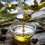 Pouring Extra Virgin Olive Oil In A Glass Bowl