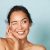 Skin Care. Woman With Beauty Face Touching Facial Skin Portrait