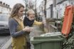 Responsible British Mother Teaching Toddler How To Recycle