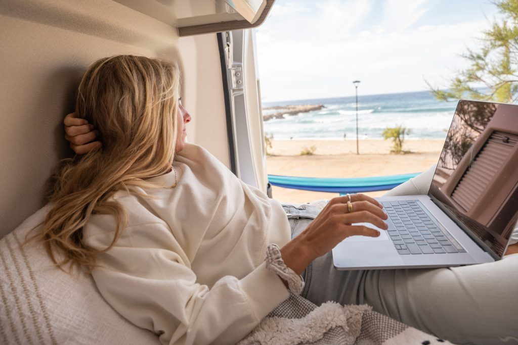 Woman Working Online From Her Campervan