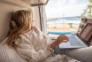 Woman Working Online From Her Campervan