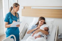 New Born Baby With His Mother At Hospital