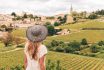 Rear View Of Woman Looking At Green Vineyard In Bordeaux Region, Saint Emilion France, Nouvelle Aquitaine