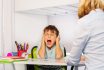 Boy Screaming While Sitting At Classroom