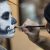 Makeup Artist Applying Skeleton Makeup On A Woman