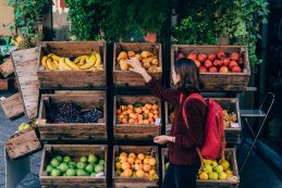 Woman Choosing Fresh Fruits On The Street Of Florence