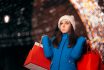 Tired Girl Holding Shopping Bags On Christmas Lights Décor