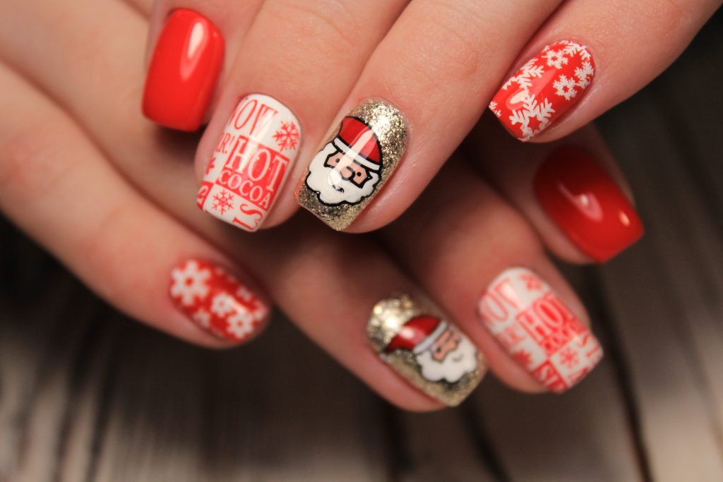 Beautiful Woman's Nails With Beautiful Christmas Manicure