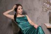 Attractive Brunette Woman In Elegant Green Aquamarine Dress In A Loft Cafe. Beautiful Sensual Girl