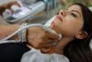 Close Up Shot Of Young Woman Getting Her Neck Examined By Doctor Using Ultrasound Scanner At Modern Clinic S