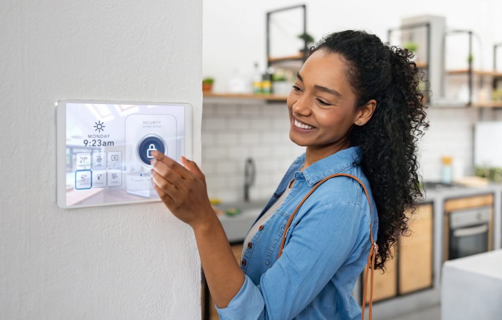 Woman Locking Her House Using A Smart Security System