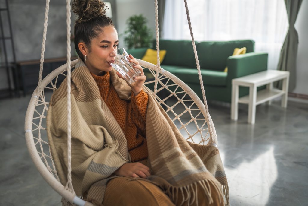 One Woman Beautiful Young Female Sit At Home With Glass Of Water