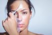 Beauty Portrait Of A Young Woman Applying Removing Face Mask