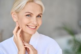 Portrait Of Smiling Mid Age Woman Looking At Camera. Skin Care Concept.