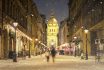 Illuminated Cityscape Of Zrinyi Street In Budapest With St Stephen's Basilica In A Snowy Winter Landscape At Dusk