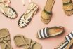 Trendy Summer Shoes Over Pastel Pink Background, Top View