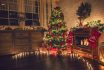 Decorated Christmas Tree Near Fireplace At Home