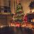 Decorated Christmas Tree Near Fireplace At Home