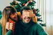 Romantic Young Couple Exchanging Christmas Gifts