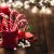 Christmas Backgrounds: Candy Canes In A Red Mug On Rustic Wooden Table. Copy Space