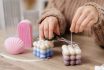 Woman Making Candles At Home, Close Up Of Female Hands Cutting Wick Of Bauble Candle On Table