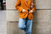 Stylish Asian Woman Leaning On Wall With Hands In Pocket On The Street.