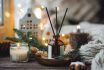 Christmas Home Aromatherapy. Aroma Diffuser With Pine Extract, Organic Essential Oil, Cedar And Spruce Cone, Cinnamon, Anise, Vanilla Scent, Candles, Wooden Table. Cozy Atmosphere, Winter Inspiration