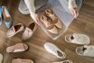 Woman Hands Packing Beige Shoes On Heels Into Plastic Box For Comfortable Storage Organize Top View