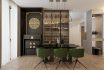 Black And Gold Decorations In A Modern Dining Room With A Black Table And Green Chairs