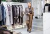 Stylish Mature Woman In Fashionable Clothing Business Outfit With Beige Trousers And Brown Tweed Blazer Standing In Female Clothing Store, Owner Of Boutique. Portrait Of Female Entrepreneur