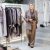 Stylish Mature Woman In Fashionable Clothing Business Outfit With Beige Trousers And Brown Tweed Blazer Standing In Female Clothing Store, Owner Of Boutique. Portrait Of Female Entrepreneur