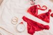 Woman's Lingerie On White Bed Sheets Flatlay