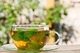 Glass Of Tea On The Wooden Desk In The Garden