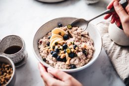 Woman Making Healthy Breakfast In Kitchen