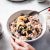 Woman Making Healthy Breakfast In Kitchen