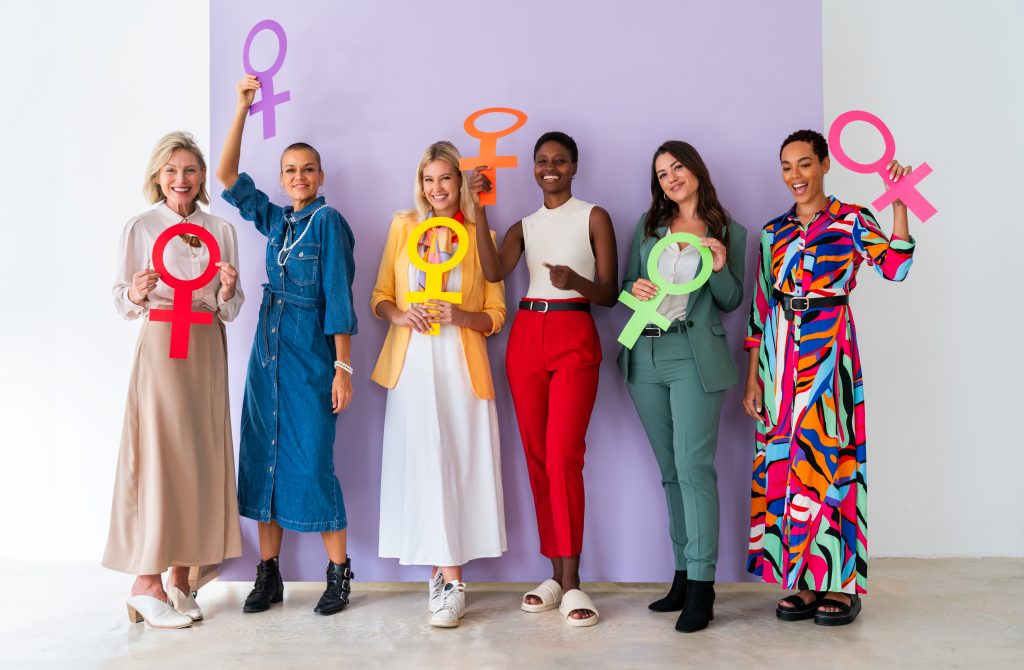 Group Of Beautiful Confident Women Holding The Femininity Venus Symbol