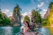 Couple Traveling By Longtail Boat At Khao Sok National Park, Chiew Lan Lake, Thailand