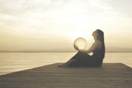 Woman Protecting A Magical Sphere Illuminated By The Sun That Releases Energy And Inner Strength, Abstract Concept