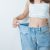 Young Slim Female Wearing Big Or Oversize Jeans, Woman Show Healthy Shape After Weight Loss. Dieting, Exercise, Body Fit And Liposuction Surgery Concept