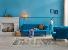 Blue Living Room, Blue Wall And Background, Blue Sofa And Chair Decoration, Carpet, Blanket And Lamp Style.