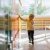 Sweet Blonde Toddler Boy Standing In Front Of A Lockers In Kindergarden Or School Hallway