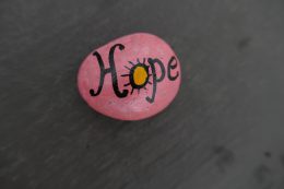 Kindness Rock With Hope Message On Pink Background