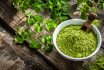 Nutritional Supplement: Moringa Powder On Rustic Table