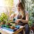 Lovely Housewife With Flower In Pot And Gardening Set